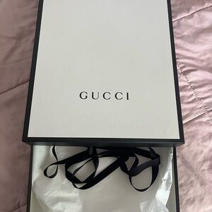 Gucci Gift Box with Black Ribbon and tissue paper
12”x16”x2 approximately
